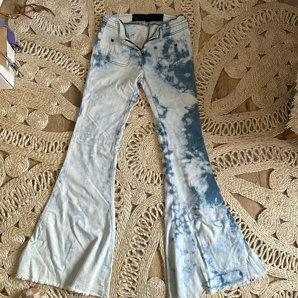 Tie-dyed light blue jeans